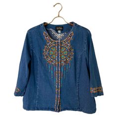 Vintage Bob Mackie Wearable Art Embroidered Denim Shirt Jacket Boho Hippie Festival Wear Such a cute top and so versatile! Heavy shirt/light jacket. Wear as a light jacket over a top, wear as pictured or belt it for a more fitted look.  Embroidered dream catcher design, logo on buttons, side pockets.  Excellent vintage condition, item comes from smoke free and pet free home.  Tagged size large, see measurement pics for sizing help. All items in my shop are sold AS-IS and there are no returns, pl Medium Wash Long Sleeve Embroidered Denim Top, Embroidered Denim Blue Top For Fall, Embroidered Relaxed Fit Denim Jacket, Long Sleeve Denim Top With Floral Embroidery, Bohemian Denim Jacket With Multicolor Embroidery, Casual Embroidered Denim Top For Fall, Casual Denim Jacket With Floral Embroidery For Festivals, Casual Floral Embroidered Denim Jacket For Festival, Bohemian Embroidered Denim Tops