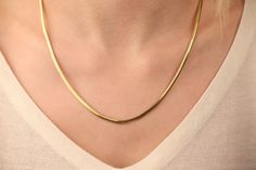 Our snake chain necklace is 14k solid gold. With its minimalist style, you can wear it every day and it fits your all outfit. It is a modern and trendy necklace.  It looks very stylish both alone and when combined with other necklaces. If you consider this gold snake chain as a gift, it makes your loves happy on their birthdays, anniversaries, graduations, mother's day, valentine's day, or women's day. 🎁 We can add a gift note for your loved ones. It arrives in a special jewelry gift box.  ✨ We respond to your questions happily. Your question will be answered within 24 hours. Do not hesitate to contact us. 💎 I hope you have a lot of Onseva's designs. :) lzm Minimalist 14k Gold Snake Chain Necklace Gift, Minimalist Snake Chain Necklace For Anniversary, Modern Yellow Gold Snake Chain Necklace As Gift, Classic 14k Gold Snake Chain Necklace As A Gift, Classic 14k Gold Snake Chain Necklace For Gift, Minimalist Yellow Gold Snake Chain Necklace As Gift, 14k Yellow Gold Snake Chain Necklace For Gift, Minimalist Yellow Gold Herringbone Necklace For Formal Occasions, Minimalist Herringbone Necklace With Box Chain As Gift