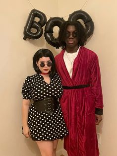 a man and woman dressed up in costumes