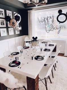 a dining room table with mickey mouse decorations