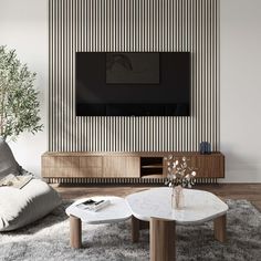 a living room with two tables and a large tv on the wall above it, in front of a striped wallpaper