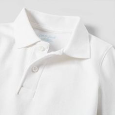 Help your child get ready for a great day at preschool with a great look with the Long-Sleeve Interlock Uniform Polo Shirt from Cat & Jack™. This elegantly simple uniform shirt comes in a white color that matches perfectly with just about any uniform bottoms. The long sleeves help keep them warmer in cooler temps, and the collared neckline adds a neat, tidy look. This shirt falls below the waist and can tucked in or left untucked, plus, the regular fit provides all-day comfortable wear. Cat & Ja Classic Long Sleeve School Shirt, Classic Long Sleeve Tops For School, White Collared Top For School, Basic White Collared Shirt, White Collared Basic Shirt, Basic White Collared Polo Shirt, Basic White School Shirt, Basic White Polo Collar Top, Fitted Long Sleeve White Polo Shirt