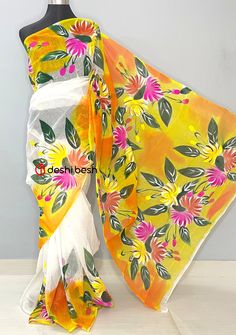 This Hand Painted Mixed Cotton Saree is perfect for your everyday and occasional use. Mixed Cotton Saree. All Over Floral Hand Painted Work. No Blouse Piece. Color: There might be slight color variation due to lighting and flashes while the photo shooting. The color may also vary because of different screen resolutions. Wash Care: Wash with cold water. White Cotton Saree For Summer, Traditional White Saree For Spring, Orange Summer Saree, Spring Festive White Saree, Festive Multicolor Saree For Spring, White Summer Saree With Pallu, Summer White Saree With Pallu Detail, Festive Multicolor Spring Saree, White Festive Saree For Summer