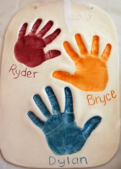 two handprints on a plaque that says ryder, bruce and dylan