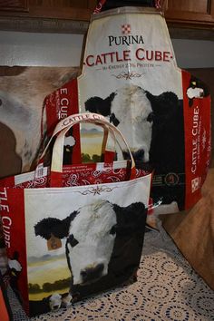 two bags with pictures of cows on them