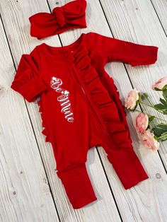 "**Listing details ** This is an adorable custom made solid red footies romper with matching solid red headband. Size Chart Newborn 17.5-18\" length (7lb-9lb) 0-3mo (19.5-20\" length) (9lb-13lbs) 3-6mo (20\"-21\" length)(13lbs-18lbs) 6-12mo (22-23\" length) (18lbs-21lbs 12-18mo (24\"-25\" length) (21lbs-25lbs) You can add personalization at check out Name is made from a vinyl cut machine Note* the photo with the white name still has the plastic backing on it. This is just for demonstration purpo Cute Fitted Red Onesie, Cute Red Fitted Onesie, Newborn Christmas Outfit, White Names, Christmas Romper, Headband Size, Red Valentine, Red Headband, Outfit Red