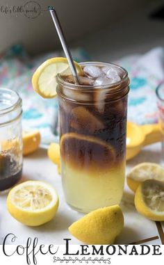 iced coffee lemonade in a mason jar with ice and sliced lemons on the side