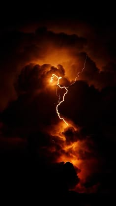 lightning striking through the clouds at night