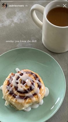 a plate with a pastry on it next to a cup of coffee