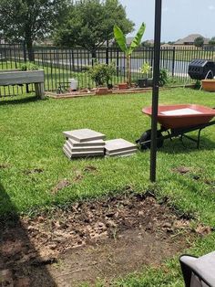 there is a wheelbarrow in the yard