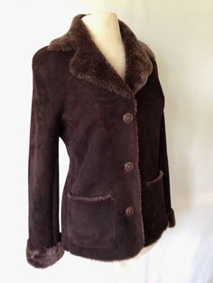 "Luscious, luxurious  shearling jacket, dark chocolate, slim flattering fit.  Just back from cleaning by a specialist--$95. The exterior is so finely sueded, it feels like velvet. It is in excellent condition. Can't go to Barneys and lay out $2500 for one like this?   Sssh-- I'll never tell! US size 7 Flat measurements: Shoulders 18\", circumference at underarm 40\", sleeve with cuffs rolled up, 24.5\", back neck length 26\". Free shipping continental USA" Fitted Brown Sheepskin Outerwear, Fitted Classic Sheepskin Fur Coat, Fitted Brown Sheepskin Fur Coat, Fitted Sheepskin Fur Coat, Classic Fitted Leather Jacket With Faux Fur Lining, Fitted Brown Leather Jacket With Faux Fur Trim, Barneys New York, Shearling Jacket, Fur Jacket