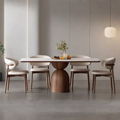 a dining table with four chairs around it