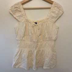 Brand New. Cream/White Old Navy Bow Front Eyelet Blouse. Size M Tall. White Feminine Peasant Top For Summer, White Summer Peasant Top For Day Out, Casual Off White Summer Blouse, Casual Off-white Summer Blouse, Casual Off-white Blouse For Summer, Casual Off White Blouse For Summer, White Short Sleeve Peasant Top For Brunch, Vintage Cream Blouse With Ruffles, White Eyelet Button-up Blouse