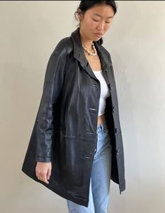 Vintage 90s black buttery soft leather jacket featuring timeless funnel collar, favorite raglan sleeves and lightly padded shoulder.  With stunning bakelite buttons and bound button holes.  Easy fit with swing shape and deep side pockets.  Fully lined.  90s Genuine black lambskin by Worthington  Bust 41  Waist 44  Hips 55  Length 35  Raglan Shoulder approx 16  Sleeve 25 Model is 5"10 size 4 90s Leather Jacket Outfit, 90s Leather Jacket, Vintage Black Leather Jacket, Bakelite Buttons, Lambskin Jacket, Leather Jacket Outfits, Button Holes, Vintage Leather Jacket, Leather Jacket Black