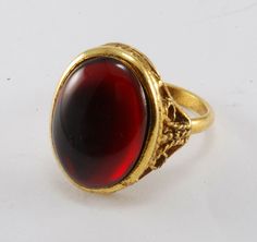 Vintage Ladies Gold Plated Red Glass Brass Filigree Ring Adjustable New Old Stock Imperfect SUPER COOL 1970'S RED GLASS RING WITH A FILIGREE SIDE HAS AN UNREADABLE PAT. NUMBER ON BACK OF THE RING PLEASE SEE ALL THE PICS ADJUSTABLE SIZE PLEASE NOTE THESE RINGS ARE BRAND NEW OLD STOCK THE GEM MAY BE GLUED SLIGHTLY OFF CENTER Antique Gold Rings, Brass Filigree, Glass Ring, Big Rings, Red Band, Glass Rings, Filigree Ring, Favorite Rings, Red Glass