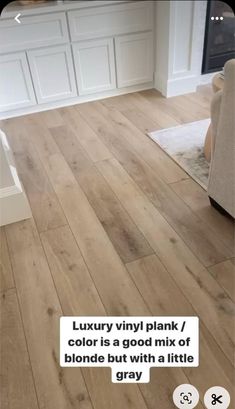 a living room with wood flooring and white furniture in the background text reads luxury vinyl plank / color is a good mix of blonde but with a little gray