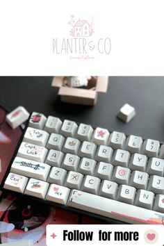 a computer keyboard sitting on top of a table