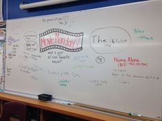 a white board with writing on it in a classroom