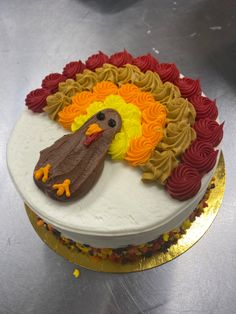 a cake decorated with icing and frosting is sitting on a table