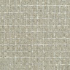 an upholstered beige fabric textured with small squares