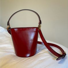 Hyer Goods Luxe Mini Bucket Bag In Glazed Red Leather. Excellent Used Condition, No Flaws Elegant Tan Bucket Bag, Bucket Bag With Gold-tone Hardware For Gift, Gift Shoulder Bag With Gold-tone Hardware, Elegant Burgundy Leather Bucket Bag, Chic Red Handheld Bucket Bag, Red Top Handle Bucket Bag For Everyday, Chic Red Bucket Bag For Daily Use, Elegant Bucket Bag With Adjustable Strap As Gift, Classic Handheld Bucket Bag For Formal Occasions