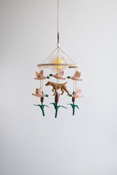 a bird mobile hanging from the ceiling