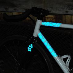 a close up of a bike with blue lights on it