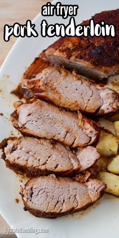 there is meat and potatoes on the plate with text overlay that reads air fryer pork tenderion