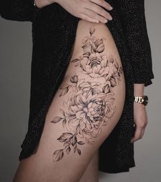 a woman's thigh with flowers on it