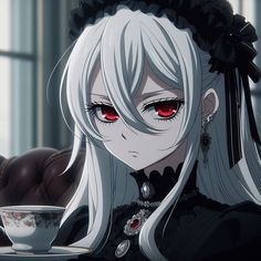 a woman with white hair and red eyes sitting at a table in front of a cup