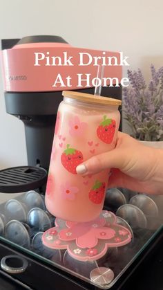 pink drink at home with strawberries on it