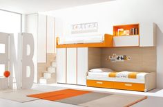 an orange and white bunk bed in a small room with stairs leading up to it