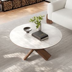 a living room with a white couch and coffee table