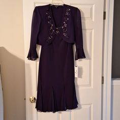 Beautiful Dress With Legacy Bolero Jacket 2 Piece Set With Sequins And Intricate Design. Color: Cocktail Grape Size 14 100% Polyester Brand New, Never Worn With Original Tags. Great To Wear For A Special Event, Cocktail Party, Wedding, Or Any Special Occasion. Elegant Knee-length Party Outerwear, Elegant Purple Party Outerwear, Vintage Purple Formal Outerwear, Purple Button-up Outerwear With Button Closure, Bolero Jacket, Miss Dress, Cocktail Party, Special Events, Special Occasion