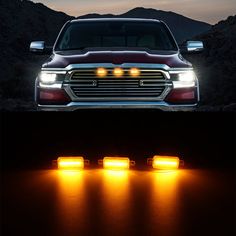 the front and side view of a truck with its lights on