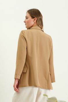 Elevate your professional wardrobe with our Tan Solid Folded Sleeve Blazer. The folded sleeves add a touch of sophistication, while the tan color gives a polished and versatile look. Made with high-quality materials, this blazer is sure to impress. Perfect for any occasion, from the office to a night out. Solid Color Fall Blazer For Office, Solid Blazer For Office In Fall, Fall Office Blazer, Spring Formal Brown Blazer, Brown Office Blazer, Solid Color Blazer For Business Casual In Fall, Solid Color Notched Blazer For Workwear, Versatile Solid Long Sleeve Blazer, Solid Blazer For Business Casual In Fall