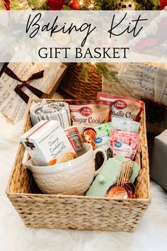 a basket filled with food next to a christmas tree and gift tags on the table