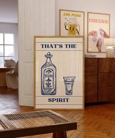 there is a sign that says that's the spirit next to a wooden table