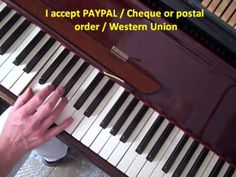 someone is playing the piano with their hand on it's keyboard and text that reads, i accept payal / cheque or postal order / western union