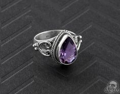 Silver and Teardrop Amethyst Gemstone Ring Purple Amethyst Teardrop Ring, Purple Teardrop Gemstone Rings, Teardrop Amethyst Ring For Anniversary, Teardrop Amethyst Ring In Purple, Purple Teardrop Amethyst Ring, Teardrop Amethyst Ring For Gift, Teardrop Amethyst Ring As Gift, Teardrop Rings With Gemstone Accents As Gifts, Teardrop Amethyst Ring