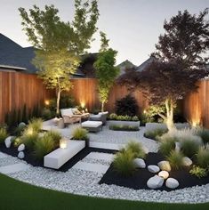 an outdoor garden is lit up with lights and landscaping items in the middle of it