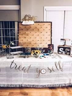 a table with a sign that says treat yourself on it