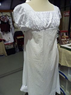 lovely embroidered fabric with short sleeves and button fastening at the back. (the mannequin is too big for the dress) The dress is a size UK 12 Thank you for looking White Cap Sleeve Summer Dress, White Broderie Anglaise Regency Dress, White Regency Broderie Anglaise Dresses, White Regency Style Broderie Anglaise Dresses, Summer Cotton Regency Dress, Fitted Short Sleeve Regency Style Dresses, Regency Style Cotton Summer Dress, Summer Regency Style Cotton Dress, Fitted Embroidered Dress With Lace Trim And Short Sleeves