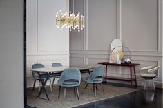 a dining room table with chairs and a chandelier