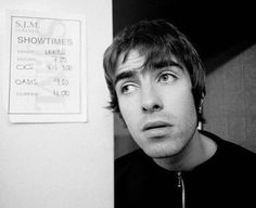 black and white photograph of a young man looking at the camera with an intense look on his face