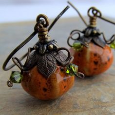 "CUTEST LIL' PUMPKIN EARRINGS EVER These beautiful, miniature gourd, ceramic beads, are accented with antique brass, leafy caps and wire curled into little vines. Swarovski crystals tip the wires like tiny leaves. Full of detail, these little earrings are a great gift for your favorite hostess, or the perfect accessory for your fall wardrobe. Diameter: 1/2\"(12mm) Length: 5/8\" (16mm) from bottom loop of earwire of your choice. All Debra Dane jewelry arrives in a pretty box suitable for gifting. Autumnal Crafts, Gourd Earrings, Bead Dolls, Boho Jewlery, Pumpkin Jewelry, Autumn Earrings, Holiday Beading, Witch Earrings, Holiday Earrings