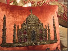 a decorative pillow with an image of a building on it