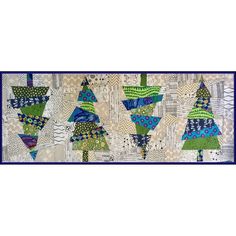 a quilted wall hanging with many different designs on it's sides and blue trim around the edges