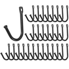 a bunch of black hooks on a white background