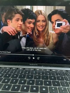 an open laptop computer with the image of friends on it